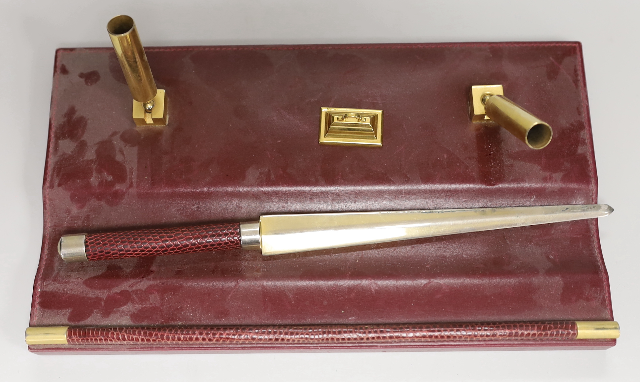 An Asprey red leather three piece desk set, tray 34.5cm long x 26cm wide, faux crocodile edges